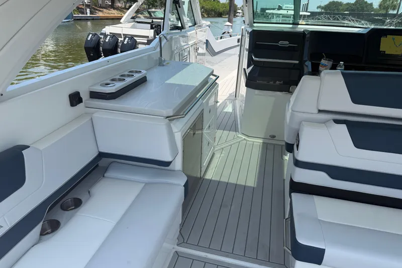 Slide: The Image of Luxurious interior of 2026 Formula 380 Super Sport Crossover OB boat with sleek seating and amenities. - 18