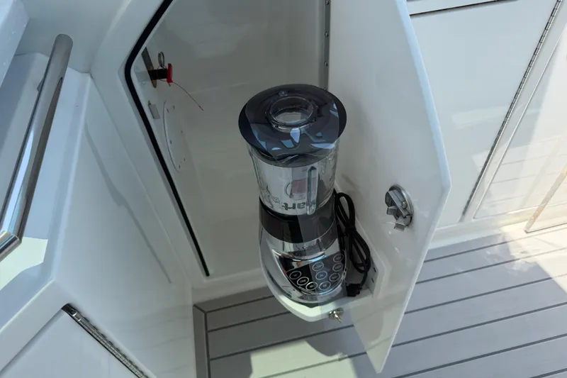 Slide: The Image of Blender stored in a cabinet on a 2026 Formula 380 Super Sport Crossover OB boat. - 22
