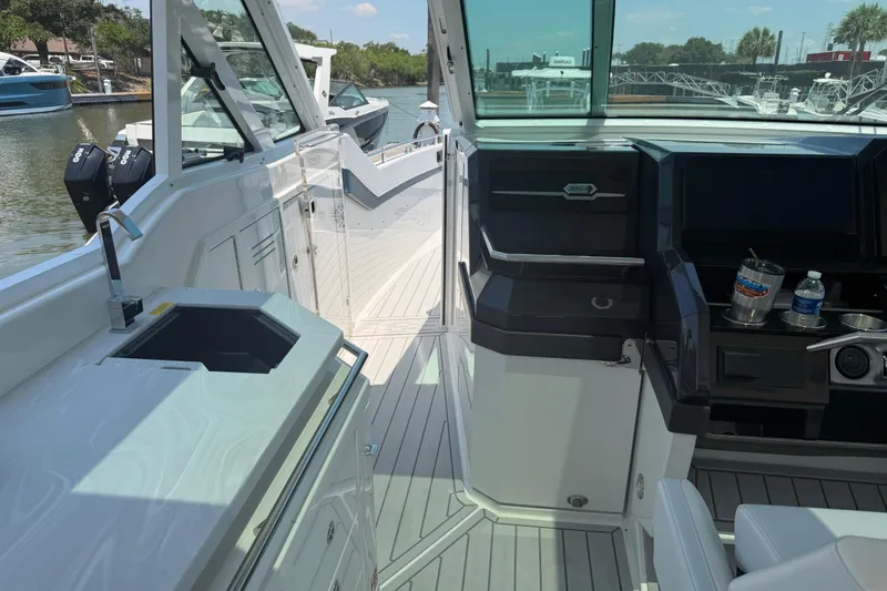 Slide: The Image of Interior view of 2026 Formula 380 Super Sport Crossover OB boat, featuring sleek design and amenities. - 23