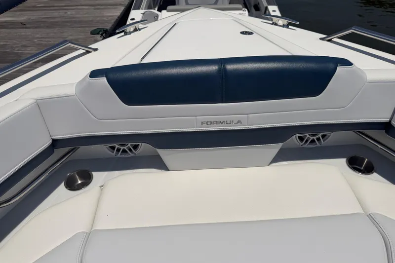 Slide: The Image of 2026 Formula 380 Super Sport Crossover OB boat interior with sleek seating and cup holders. - 29
