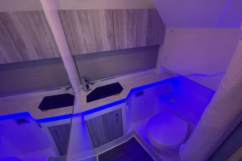 Slide: The Image of Modern bathroom interior of 2026 Formula 380 Super Sport Crossover OB with sleek design and blue lighting. - 35