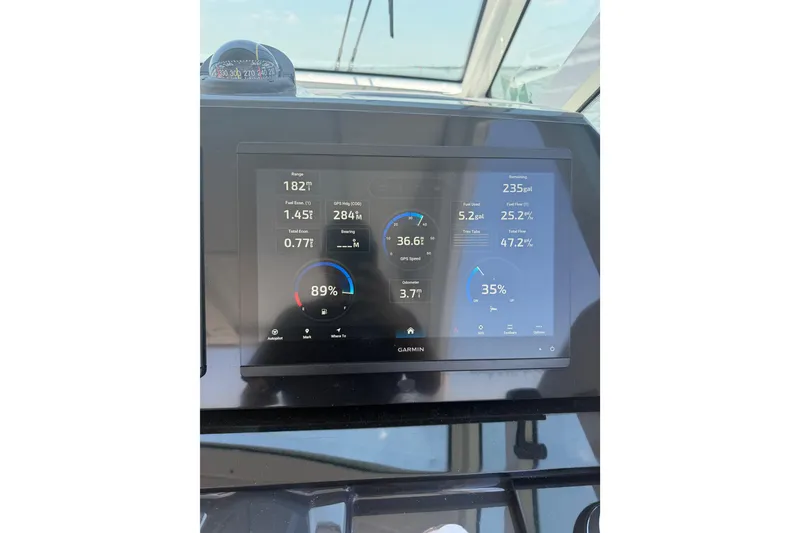 Slide: The Image of Dashboard display of a 2026 Formula 380 Super Sport Crossover OB boat, showing navigation and fuel data. - 43