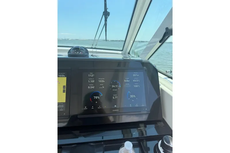 Slide: The Image of Dashboard view of 2026 Formula 380 Super Sport Crossover OB on open water. - 44
