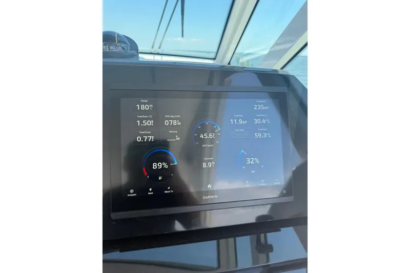 Slide: The Image of Garmin display on 2026 Formula 380 Super Sport Crossover OB showing navigation and fuel data. - 46