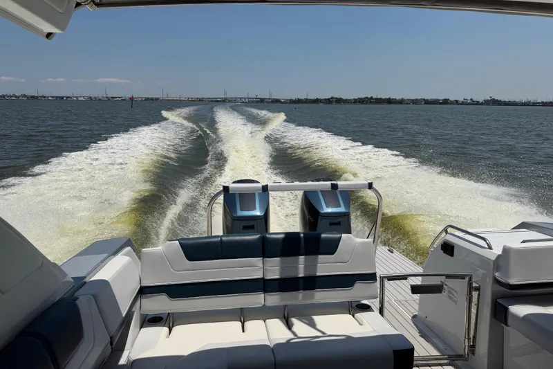Slide: The Image of 2026 Formula 380 Super Sport Crossover OB cruising on open water, leaving a wake trail. - 8