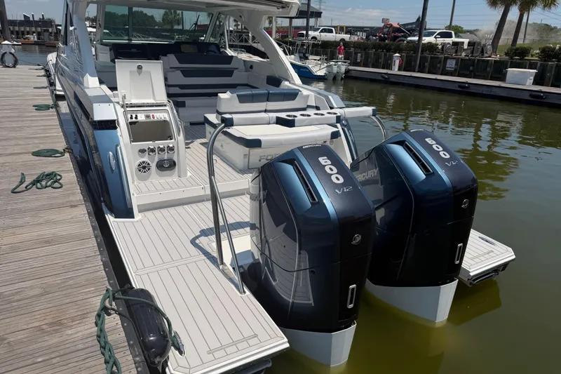 Slide: The Image of 2026 Formula 380 Super Sport Crossover OB with twin Mercury 600 V12 engines docked. - 9