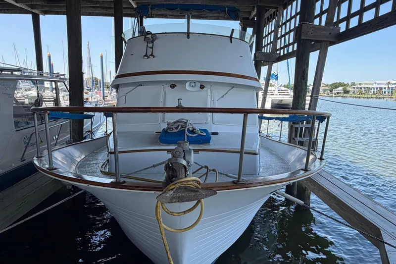 Slide: The Image of 1978 Albin 36 Trawler docked in a marina, showcasing classic nautical design. - 2