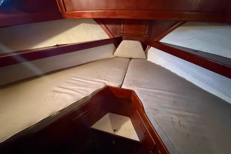 Slide: The Image of Interior cabin of 1978 Albin 36 Trawler with V-berth and wooden finish. - 21