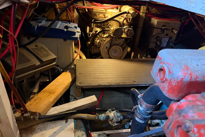 Slide: The Image of Engine room of a 1978 Albin 36 Trawler with visible wiring and components. - 33