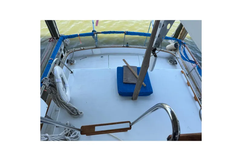 Slide: The Image of 1978 Albin 36 Trawler deck with ropes and life preserver. - 9