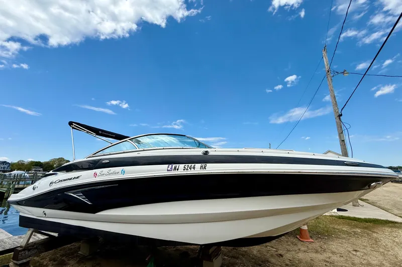The Image of 2020 Crownline Eclipse E235 boat docked under a clear blue sky. - 0