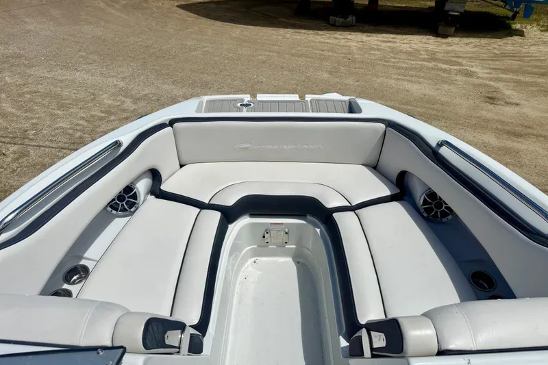Slide: The Image of 2020 Crownline Eclipse E235 boat interior with white seating and speakers. - 17