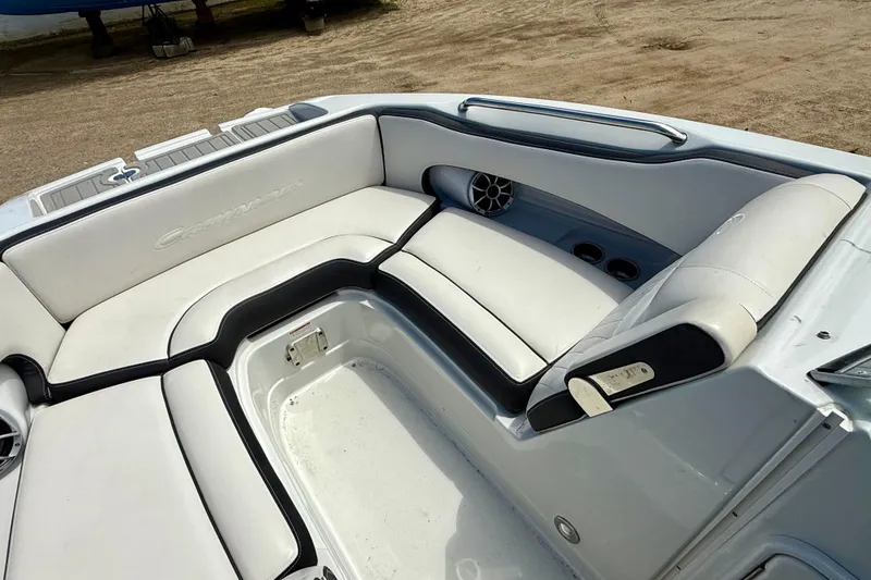 Slide: The Image of 2020 Crownline Eclipse E235 boat interior with white cushioned seating. - 24