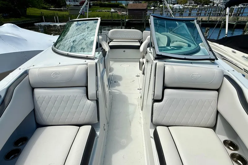 Slide: The Image of 2020 Crownline Eclipse E235 boat interior with luxurious seating and sleek design. - 26