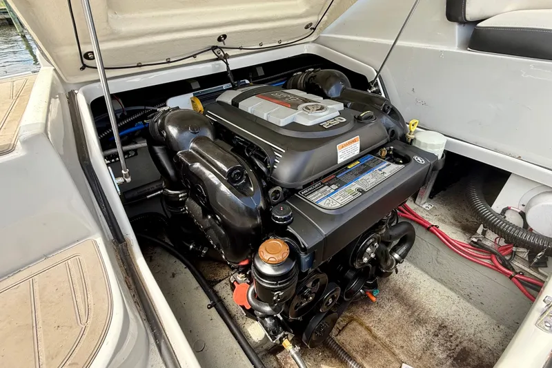 Slide: The Image of 2020 Crownline Eclipse E235 boat engine compartment with Mercury engine visible. - 33