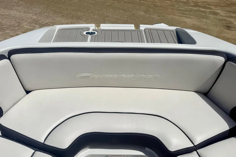 Slide: The Image of Crownline Eclipse E235 2020 boat interior with white cushioned seating. - 4