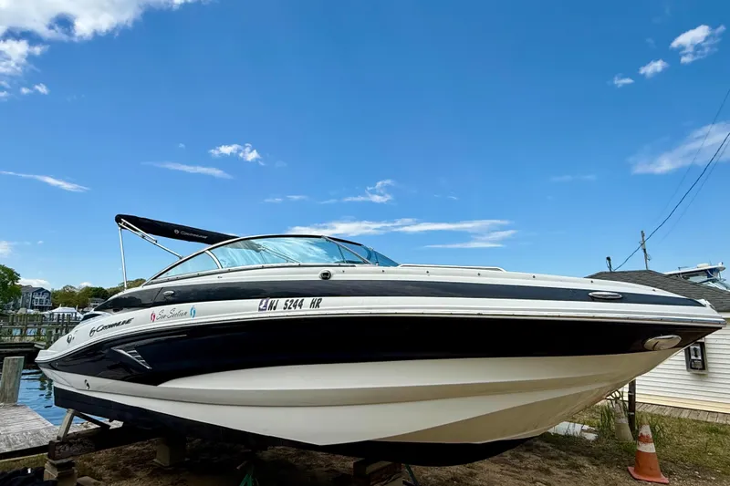 Slide: The Image of 2020 Crownline Eclipse E235 boat docked under a clear blue sky. - 40