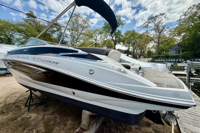 Slide: The Image of 2020 Crownline Eclipse E235 boat on display, featuring sleek design and modern amenities. - 42