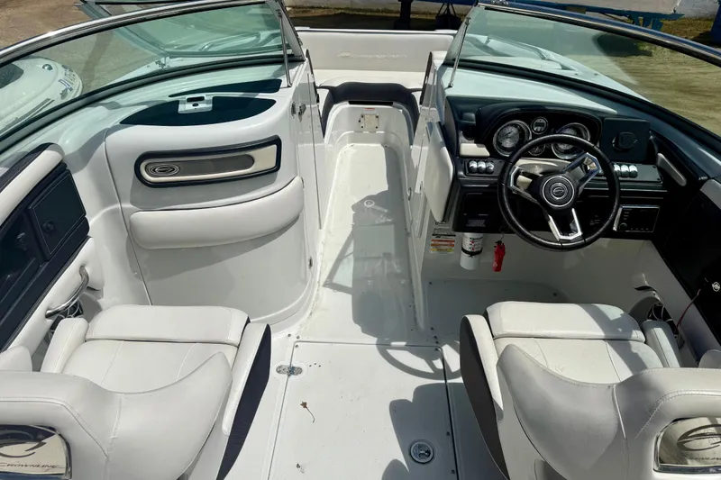 Slide: The Image of 2020 Crownline Eclipse E235 boat interior with steering wheel and seating. - 5