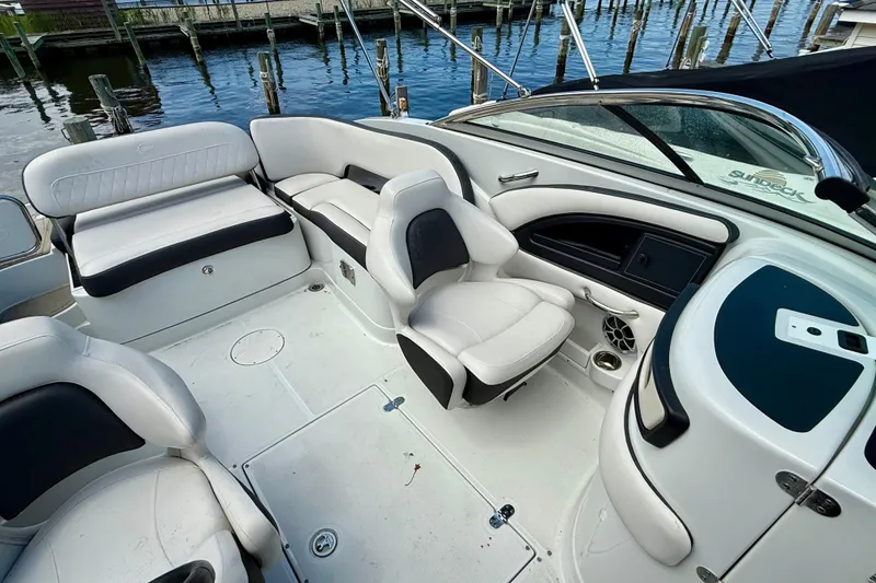 Slide: The Image of 2020 Crownline Eclipse E235 boat interior with white seating and sleek design. - 8