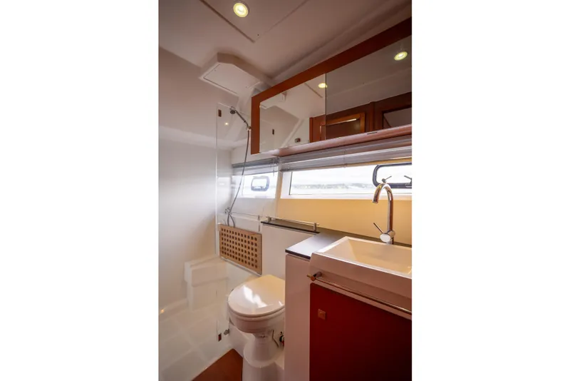 Slide: The Image of Bathroom interior of 2017 Jeanneau NC 14 yacht, featuring modern fixtures and ample lighting. - 19