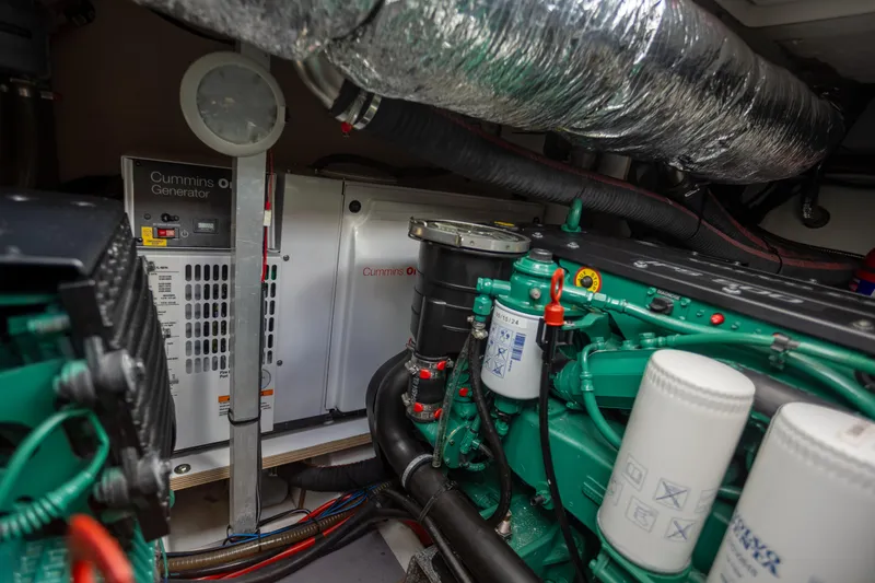 Slide: The Image of Engine room of 2017 Jeanneau NC 14 with Cummins generator and mechanical components. - 24