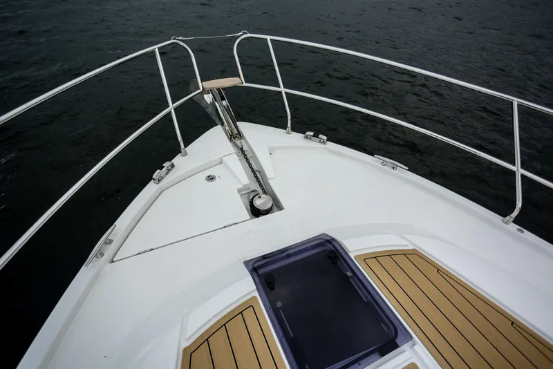 Slide: The Image of Bow view of 2017 Jeanneau NC 14 yacht with teak decking and anchor system. - 3