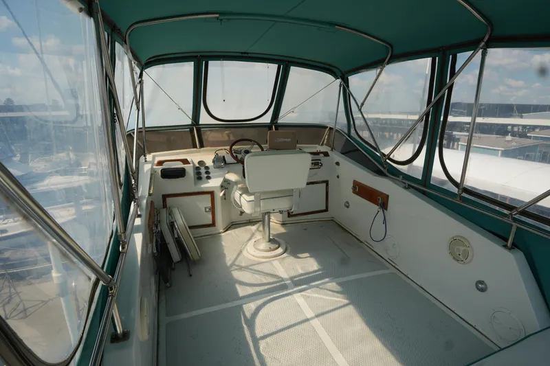 Slide: The Image of Interior view of a 1960 Matthews 42 Stock Cruiser boat cockpit with steering wheel. - 12
