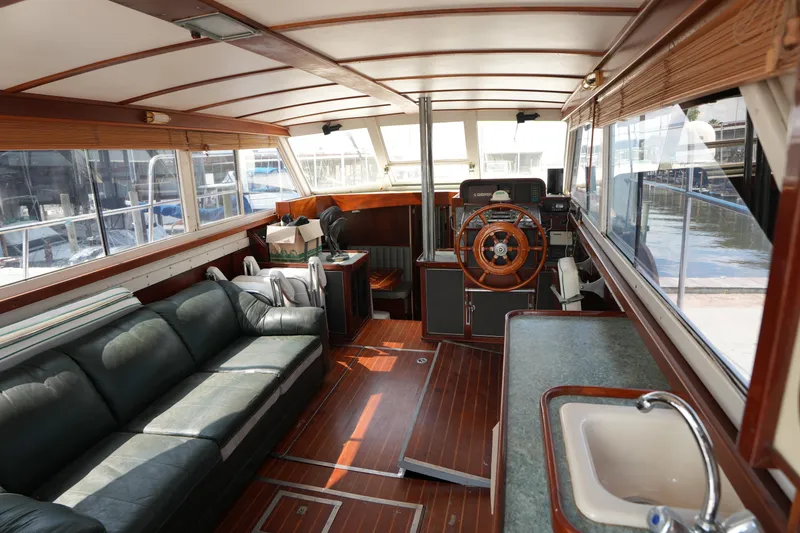 Slide: The Image of Interior of a 1960 Matthews 42 Stock Cruiser with wooden accents and leather seating. - 15