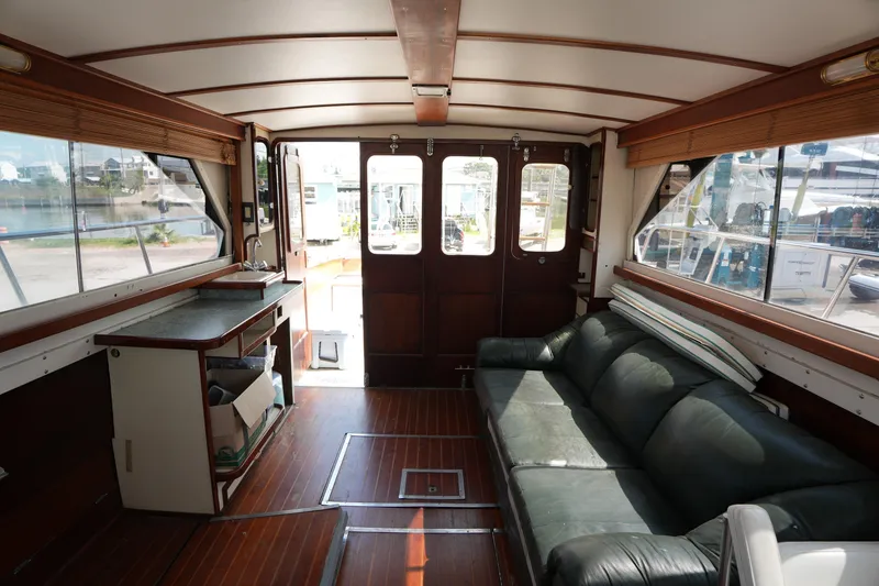 Slide: The Image of Interior of 1960 Matthews 42 Stock Cruiser with wooden flooring and leather seating. - 16