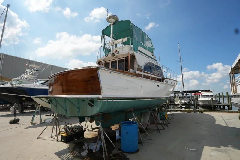 Slide: The Image of 1960 Matthews 42 Stock Cruiser on dry dock under clear blue sky. - 2