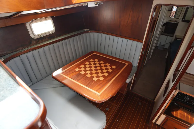 Slide: The Image of Vintage 1960 Matthews 42 Stock Cruiser interior with wood table and seating area. - 21