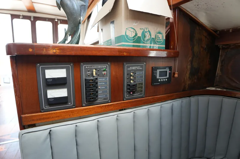 Slide: The Image of 1960 Matthews 42 Stock Cruiser interior with control panels and seating area. - 24
