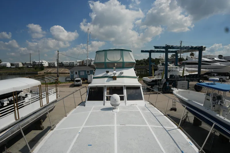 Slide: The Image of 1960 Matthews 42 Stock Cruiser docked at marina under blue sky. - 7