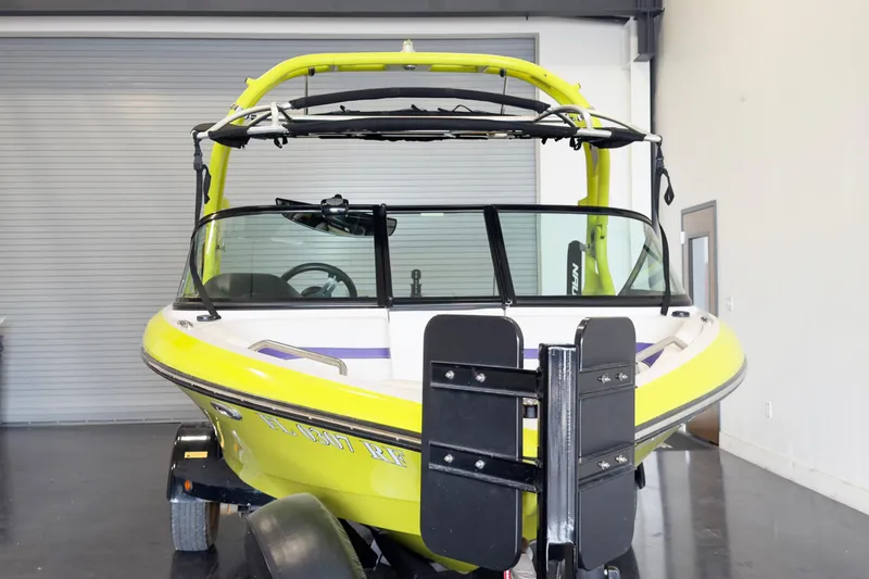 Slide: The Image of 2014 Nautique Ski Nautique 200 Closed Bow boat in a garage setting. - 3