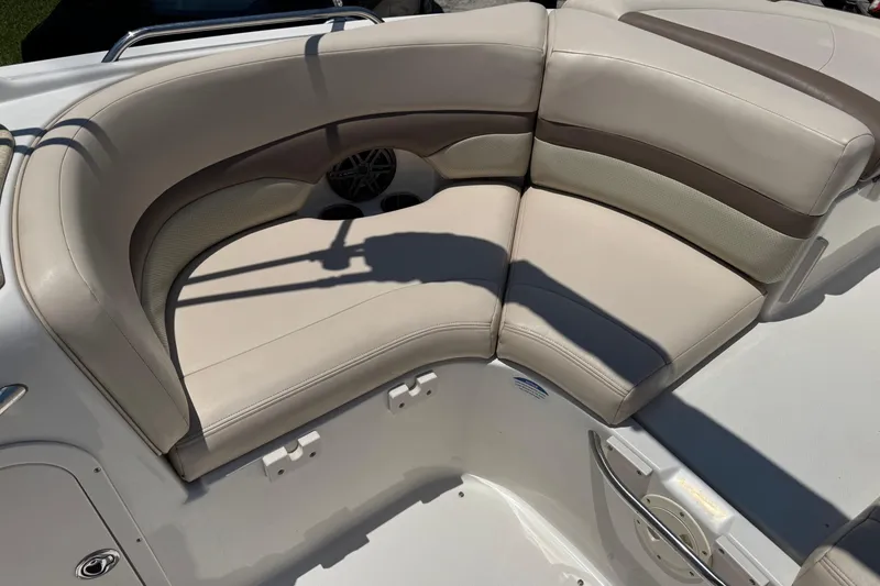 Slide: The Image of 2006 Chaparral 256 SSi boat interior with beige cushioned seating. - 13