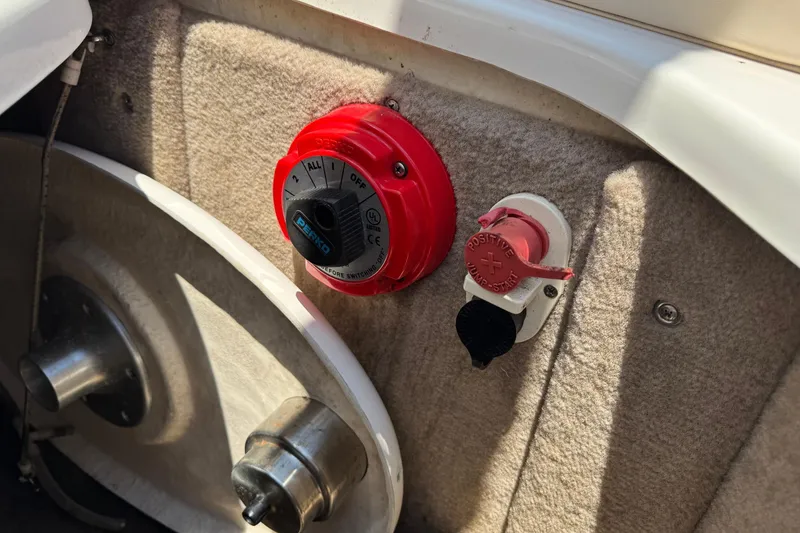 Slide: The Image of Battery switch and jump-start terminal on a 2006 Chaparral 256 SSi boat. - 18