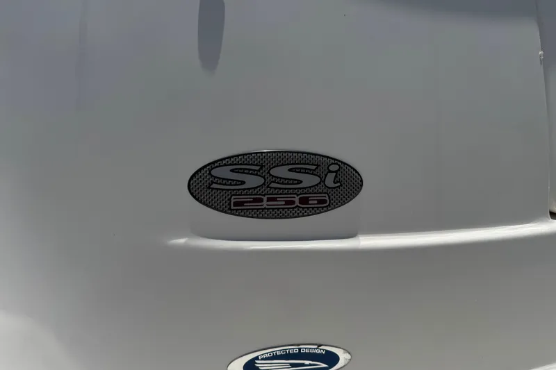 Slide: The Image of 2006 Chaparral 256 SSi boat emblem on white surface, showcasing model branding. - 2