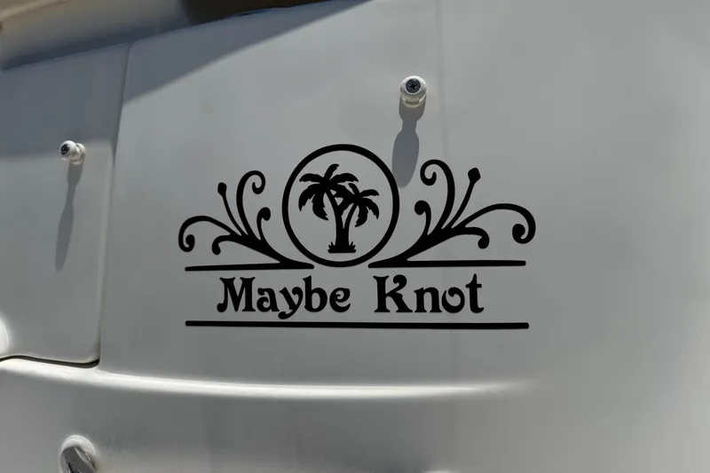 Slide: The Image of "Maybe Knot" decal on 2006 Chaparral 256 SSi boat with palm tree design. - 3