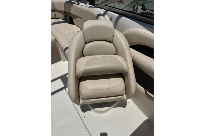 Slide: The Image of Beige leather seating on 2006 Chaparral 256 SSi boat, showcasing luxury and comfort. - 36