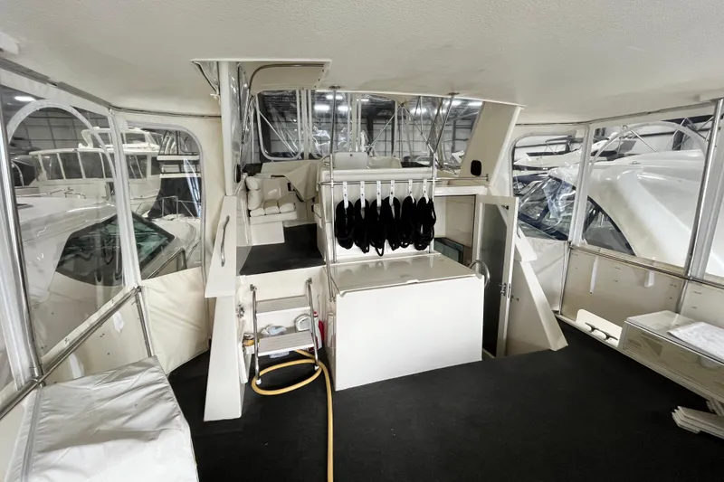 Slide: The Image of Interior view of a 1991 Hatteras 40 Double Cabin yacht, showcasing spacious seating and storage. - 11