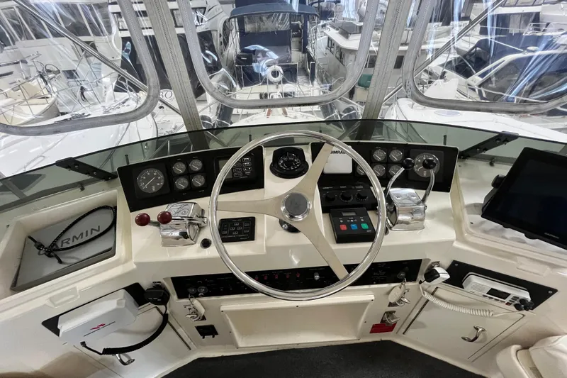 Slide: The Image of Cockpit of 1991 Hatteras 40 Double Cabin yacht with steering wheel and navigation instruments. - 5