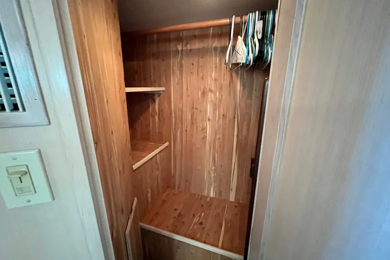 Slide: The Image of Wooden closet interior on a 1991 Hatteras 40 Double Cabin yacht. - 22