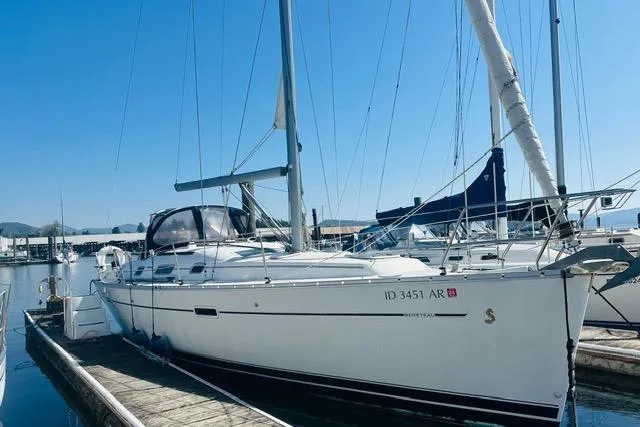 The Image of 2007 Beneteau 343 sailboat docked at marina under clear blue sky. - 1
