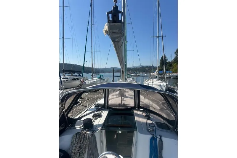 Slide: The Image of Sailboat Beneteau 343, 2007 model, docked at marina with clear blue sky. - 12
