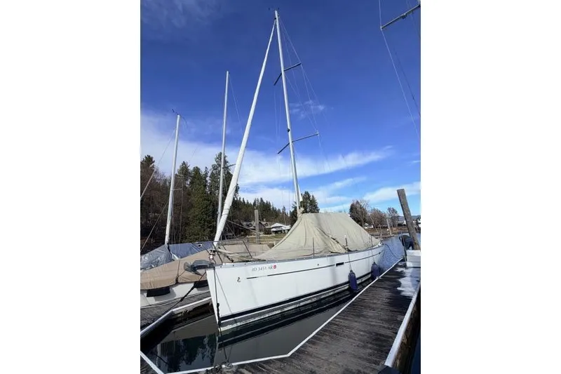 Slide: The Image of 2007 Beneteau 343 sailboat docked, covered, under clear blue sky. - 8