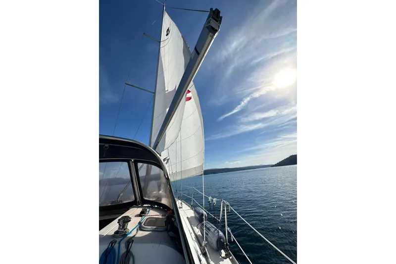Slide: The Image of Sailing on a 2007 Beneteau 343 yacht under clear blue skies. - 9