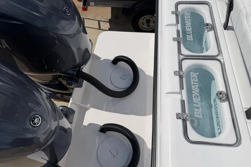 Slide: The Image of 2026 Bluewater Sportfishing 25T boat with dual engines and livewell compartments. - 10