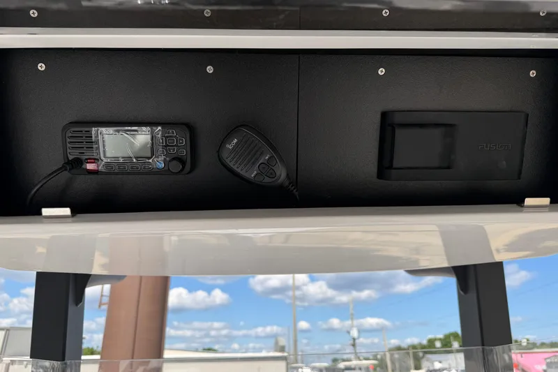 Slide: The Image of 2026 Bluewater Sportfishing 25T boat console with radio and Fusion audio system. - 19