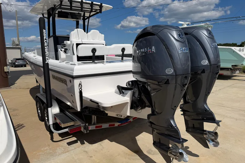 Slide: The Image of 2026 Bluewater Sportfishing 25T boat with dual Yamaha engines on a trailer. - 3